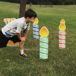 Little Boy Blowing out Yard Signs - Colorful Birthday Candles