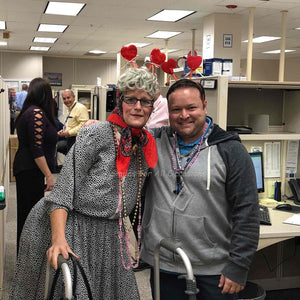 Old Lady Standing with Man with Valentine Headbands